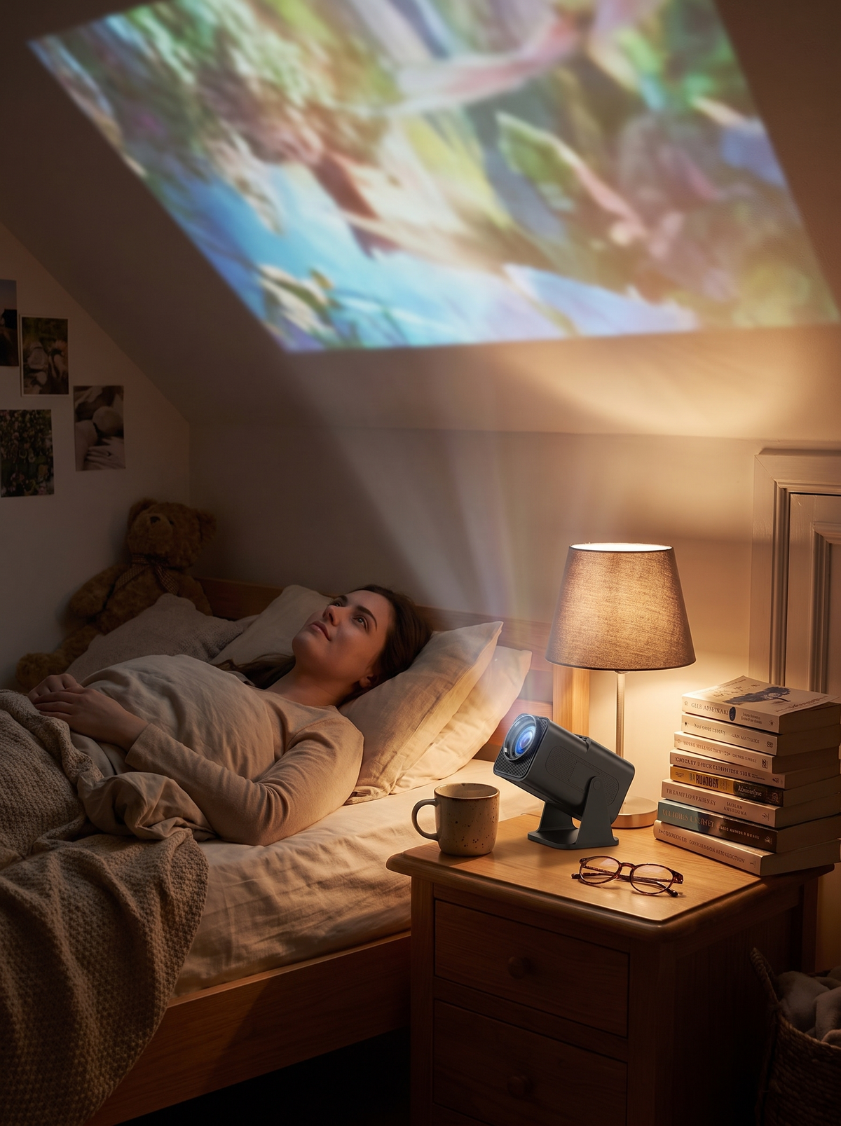 Compact mini projector on a bedside table aimed at the ceiling