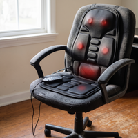 Massage cushion strapped to an empty desk chair in a home office