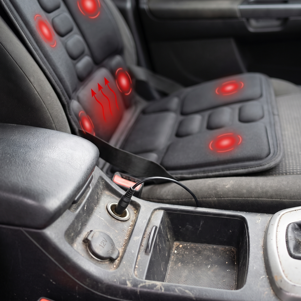 Massage cushion cable plugged into a car 12 volt socket on the centre console